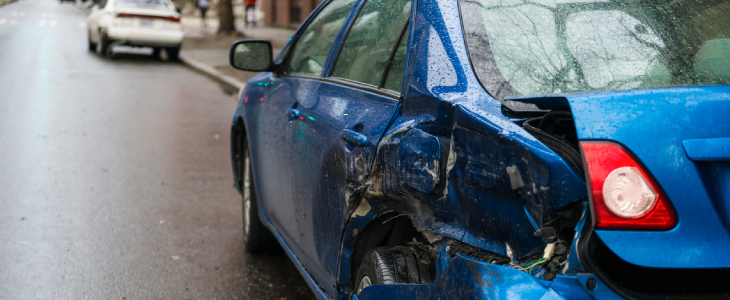 Hit and run involving a parked car on a city street.